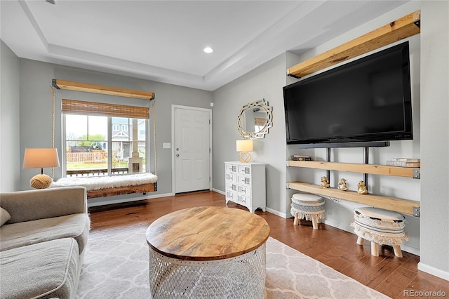 12873 E 108th Ave, Commerce City, CO 80022 - living room featuring baseboards, recessed lighting, wood finished floors, and a tray ceiling