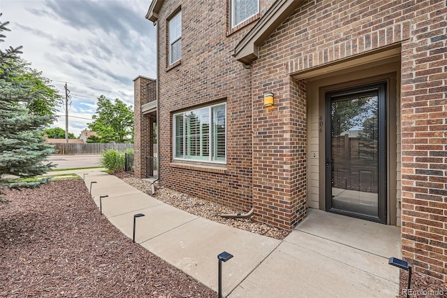 606 E Dry Creek Pl, Littleton, CO 80122 - property entrance featuring brick siding