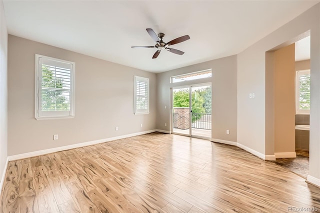 606 E Dry Creek Pl, Littleton, CO 80122 - unfurnished room featuring healthy amount of natural light, light wood-style floors, and a ceiling fan
