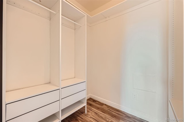 606 E Dry Creek Pl, Littleton, CO 80122 - spacious closet featuring wood finished floors