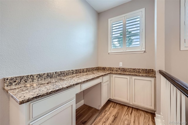 606 E Dry Creek Pl, Littleton, CO 80122 - unfurnished office featuring built in study area and light wood-style floors