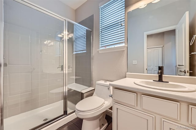 606 E Dry Creek Pl, Littleton, CO 80122 - bathroom featuring a stall shower and vanity