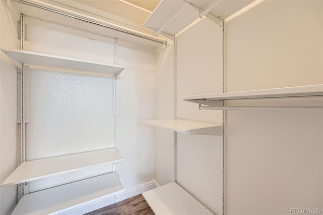 606 E Dry Creek Pl, Littleton, CO 80122 - spacious closet featuring wood finished floors