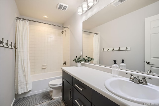 bathroom with vanity, shower / bath combination with curtain, toilet, and visible vents