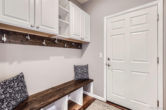 mudroom with baseboards and dark wood finished floors