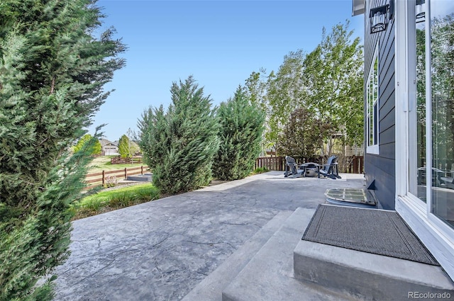 view of patio / terrace with outdoor dining area and fence