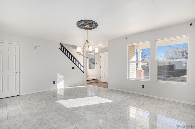 unfurnished dining area featuring an inviting chandelier