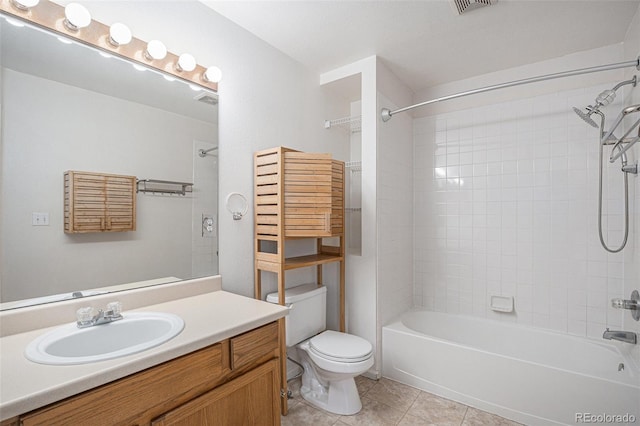 full bathroom with tile patterned flooring, shower / washtub combination, vanity, and toilet