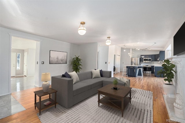 living room with light hardwood / wood-style flooring