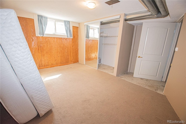 unfurnished bedroom with a closet and visible vents