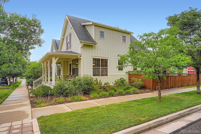 10193 E 29th Ave, Denver, CO 80238 - view of home's exterior featuring roof with shingles, board and batten siding, and a porch
