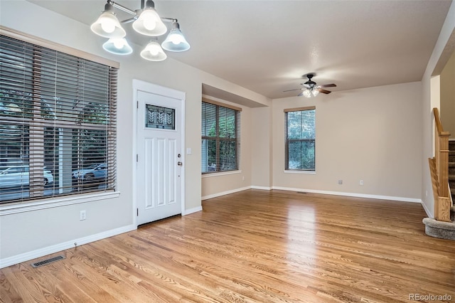 10193 E 29th Ave, Denver, CO 80238 - entryway with a chandelier, wood finished floors, ceiling fan, and stairs