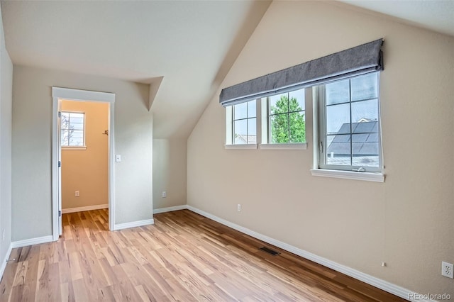 10193 E 29th Ave, Denver, CO 80238 - additional living space with healthy amount of natural light, lofted ceiling, and wood finished floors