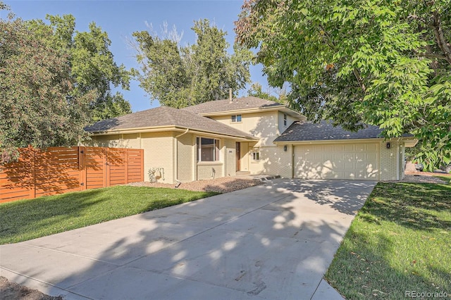 view of front facade featuring a front lawn and a garage