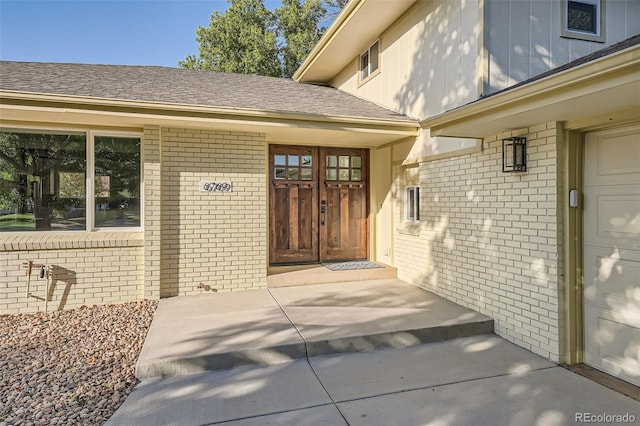 entrance to property featuring a garage