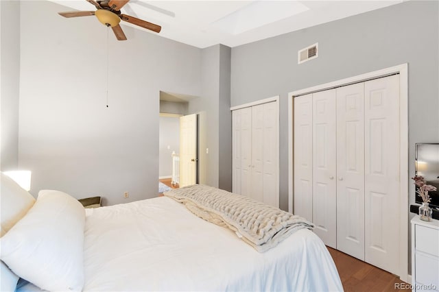 8787 W Cornell Ave Unit 6, Lakewood, CO 80227 - bedroom with high vaulted ceiling, wood finished floors, multiple closets, and a ceiling fan