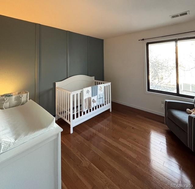 8787 W Cornell Ave Unit 6, Lakewood, CO 80227 - bedroom with wood finished floors and baseboards