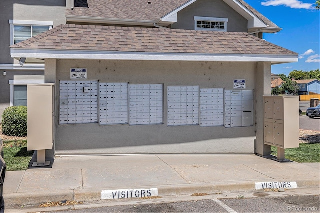 view of home's community featuring mail boxes