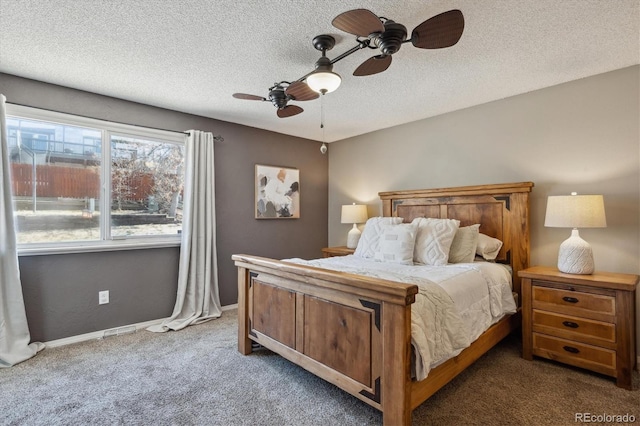 carpeted bedroom featuring ceiling fan, a textured ceiling, and baseboards