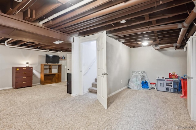 finished basement with baseboards and carpet flooring