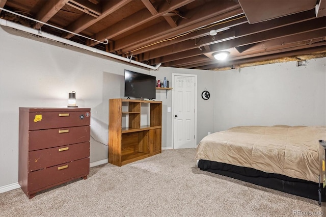 bedroom with carpet floors and baseboards