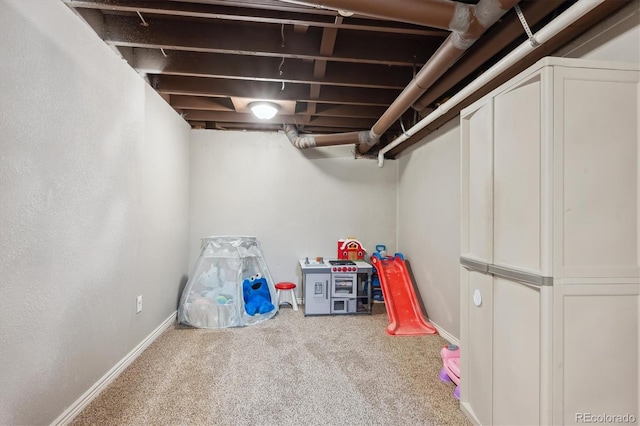 finished basement featuring carpet flooring and baseboards