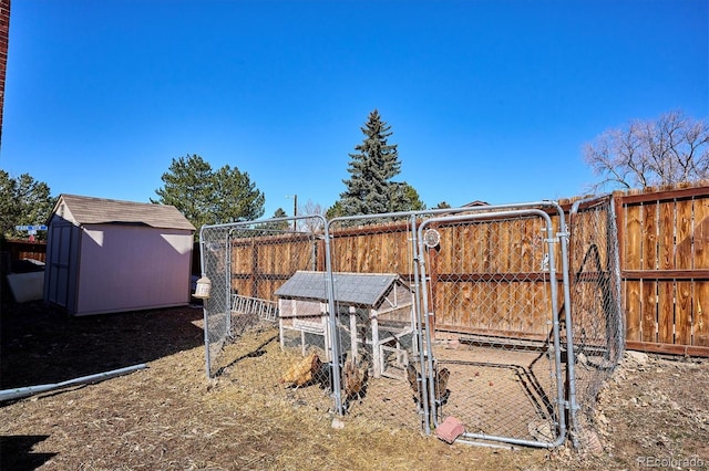 view of yard with exterior structure, fence, and an outdoor structure