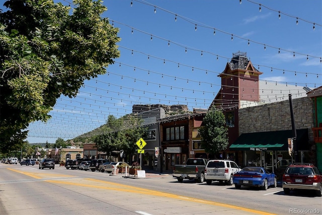 view of street featuring traffic signs and sidewalks