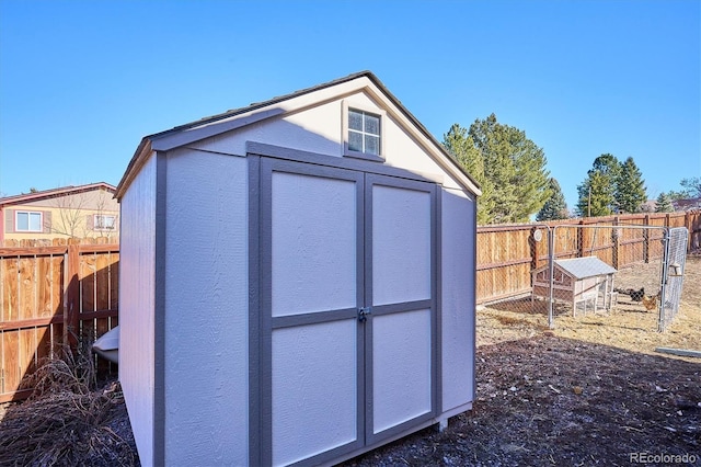 view of shed featuring a fenced backyard