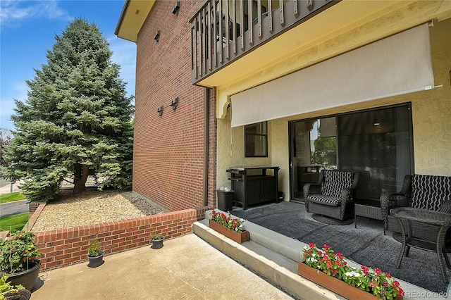 view of patio / terrace with a balcony