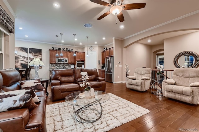 7851 E 148th Dr, Thornton, CO 80602 - living area with recessed lighting, arched walkways, ceiling fan, and dark wood finished floors