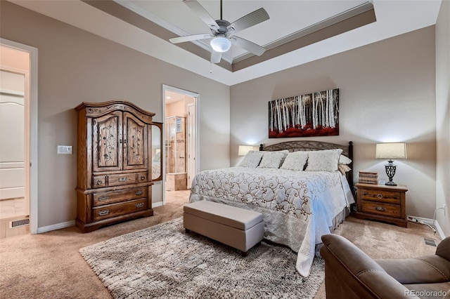7851 E 148th Dr, Thornton, CO 80602 - bedroom with visible vents, light colored carpet, baseboards, connected bathroom, and a tray ceiling