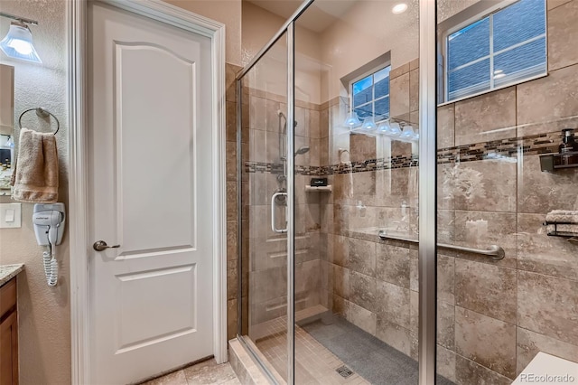 7851 E 148th Dr, Thornton, CO 80602 - bathroom featuring vanity and a stall shower