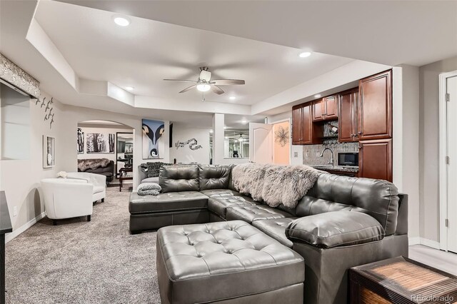 7851 E 148th Dr, Thornton, CO 80602 - living area featuring a ceiling fan, arched walkways, recessed lighting, and baseboards
