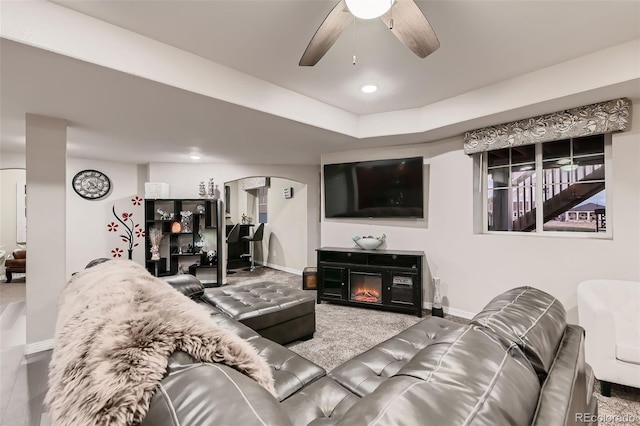 7851 E 148th Dr, Thornton, CO 80602 - living area featuring baseboards, a ceiling fan, and arched walkways