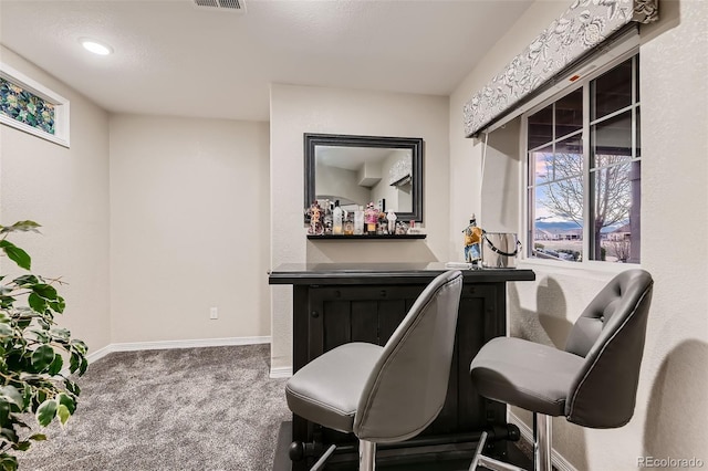 7851 E 148th Dr, Thornton, CO 80602 - sitting room with carpet floors, baseboards, visible vents, and a dry bar
