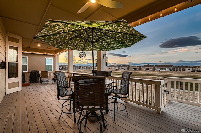 7851 E 148th Dr, Thornton, CO 80602 - deck with outdoor dining area and ceiling fan