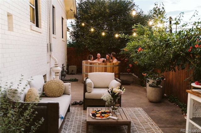 view of patio / terrace featuring fence and an outdoor hangout area