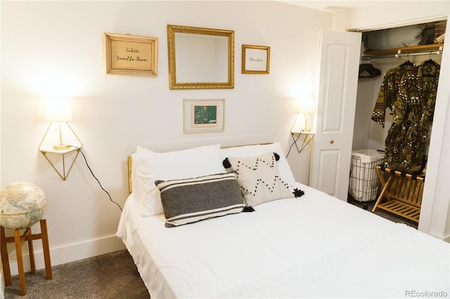 bedroom with carpet floors, baseboards, and a closet
