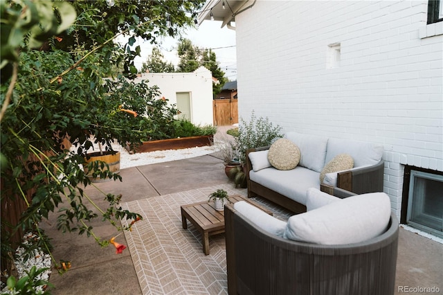 view of patio / terrace with fence and an outdoor living space