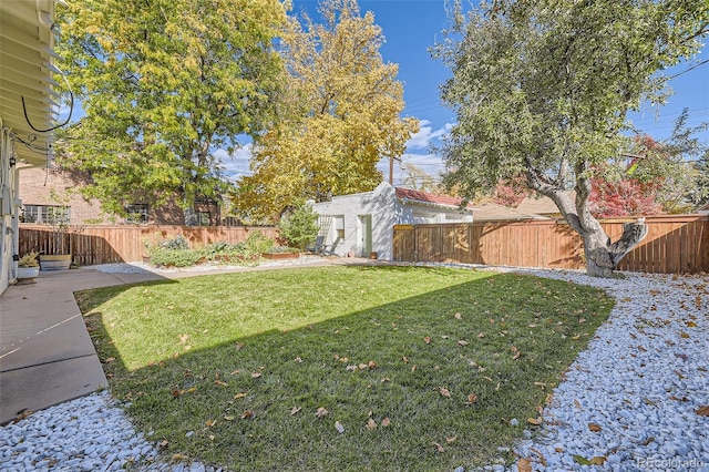 view of yard with a fenced backyard