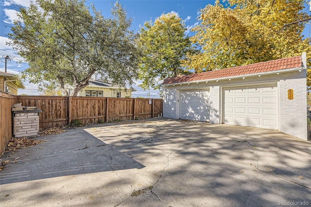 detached garage with fence