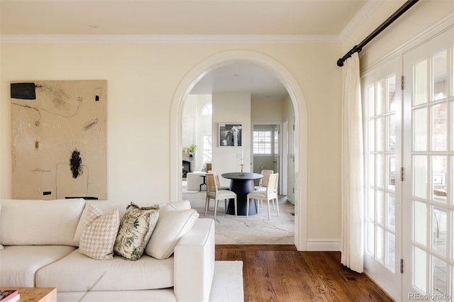 5700 S Steele St, Greenwood Village, CO 80121 - living room featuring arched walkways, wood finished floors, and crown molding