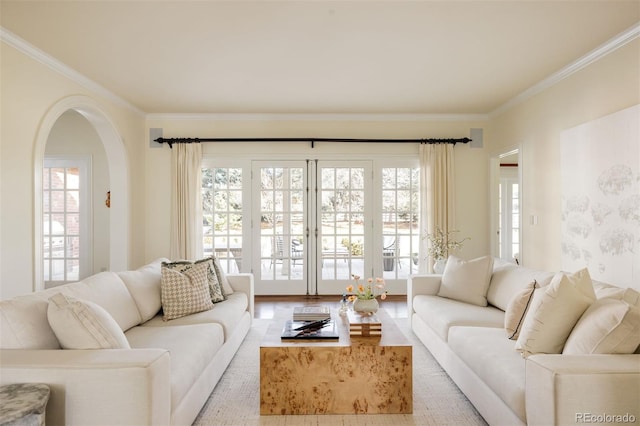 5700 S Steele St, Greenwood Village, CO 80121 - living room featuring ornamental molding, arched walkways, and plenty of natural light