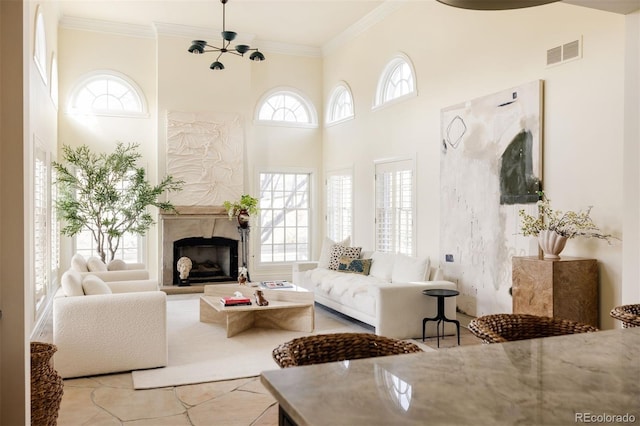 5700 S Steele St, Greenwood Village, CO 80121 - living room with a fireplace, a towering ceiling, and ornamental molding