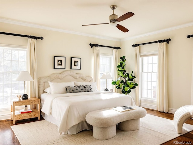 5700 S Steele St, Greenwood Village, CO 80121 - bedroom with wood finished floors, crown molding, and a ceiling fan