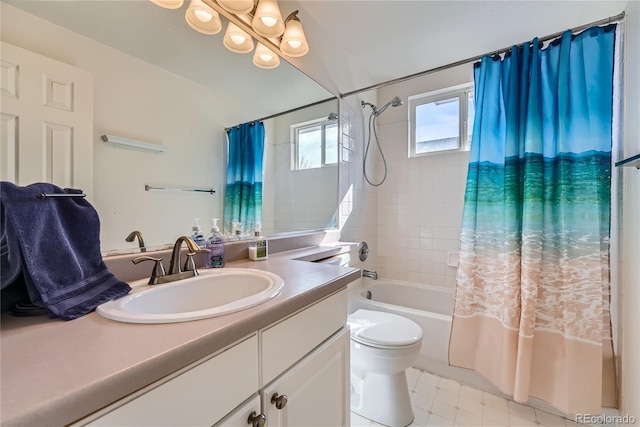 bathroom with vanity, toilet, and shower / bath combo with shower curtain