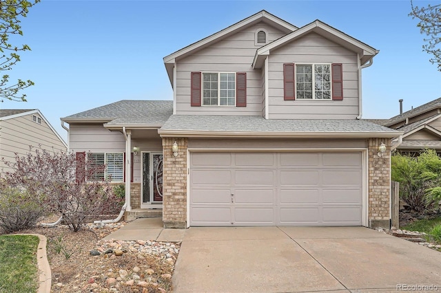 5130 S Wenatchee St, Aurora, CO 80015 - traditional-style house with an attached garage, concrete driveway, and roof with shingles