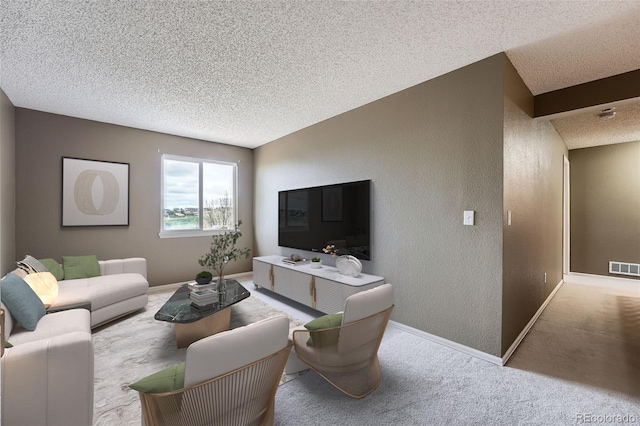 5130 S Wenatchee St, Aurora, CO 80015 - carpeted living room featuring a textured wall, a textured ceiling, and baseboards
