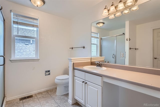 5130 S Wenatchee St, Aurora, CO 80015 - bathroom featuring a shower stall, baseboards, vanity, and toilet